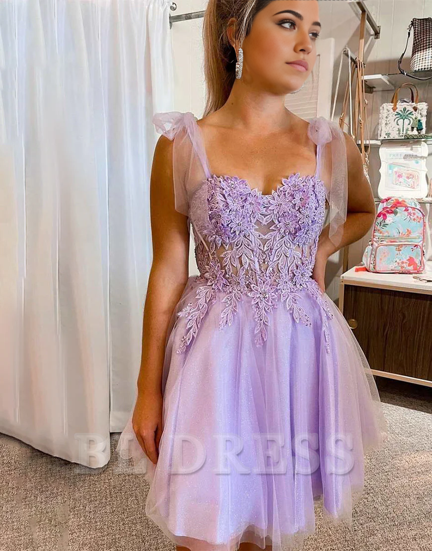 Side view of A-line formal dress with V-neck and delicate appliques.