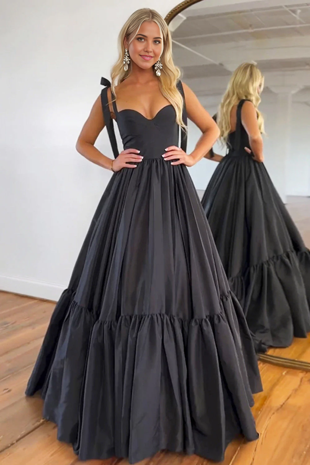 Elegant A-line black satin prom dress with tie straps.
