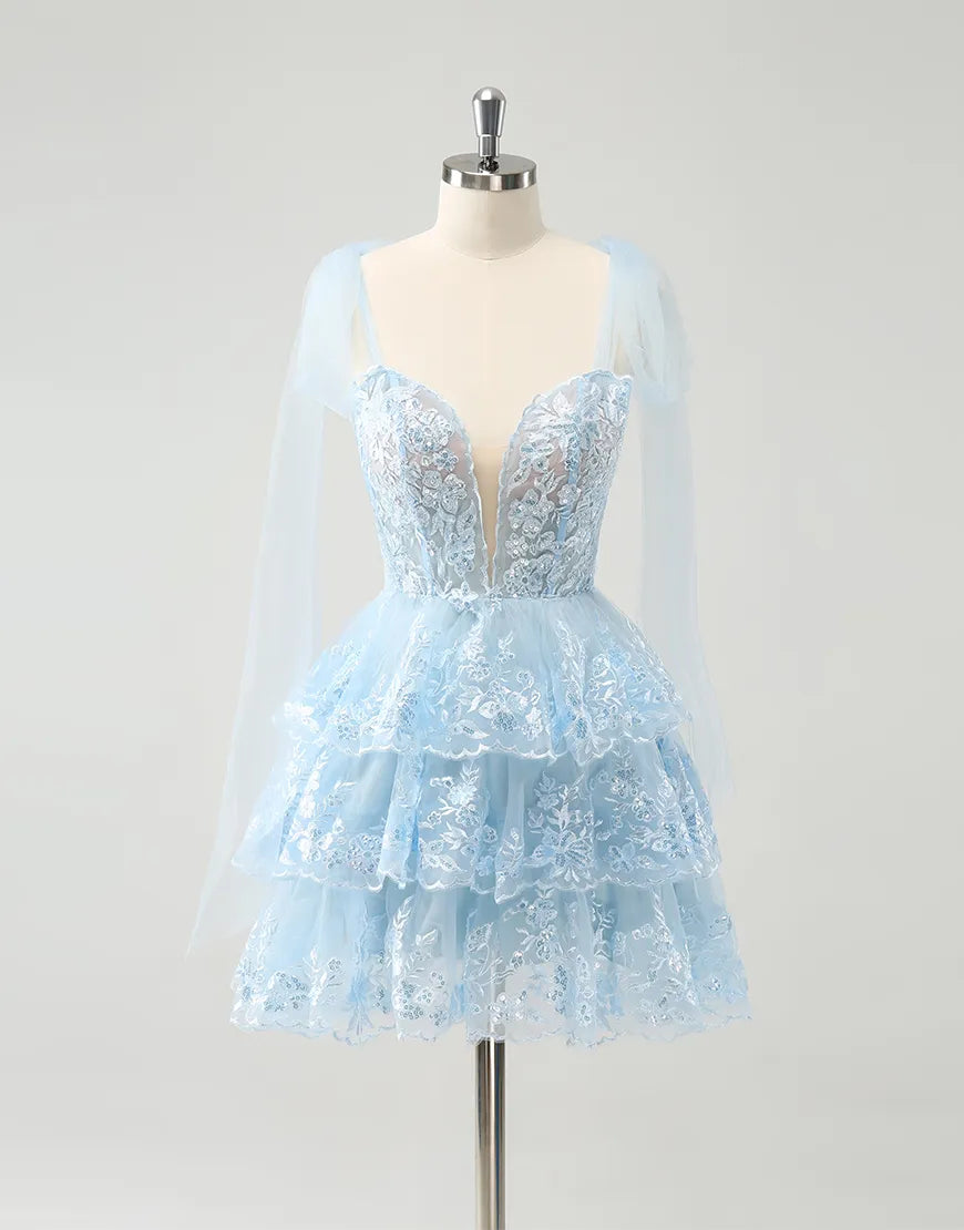 Model wearing an elegant A-line tiered tulle homecoming dress.