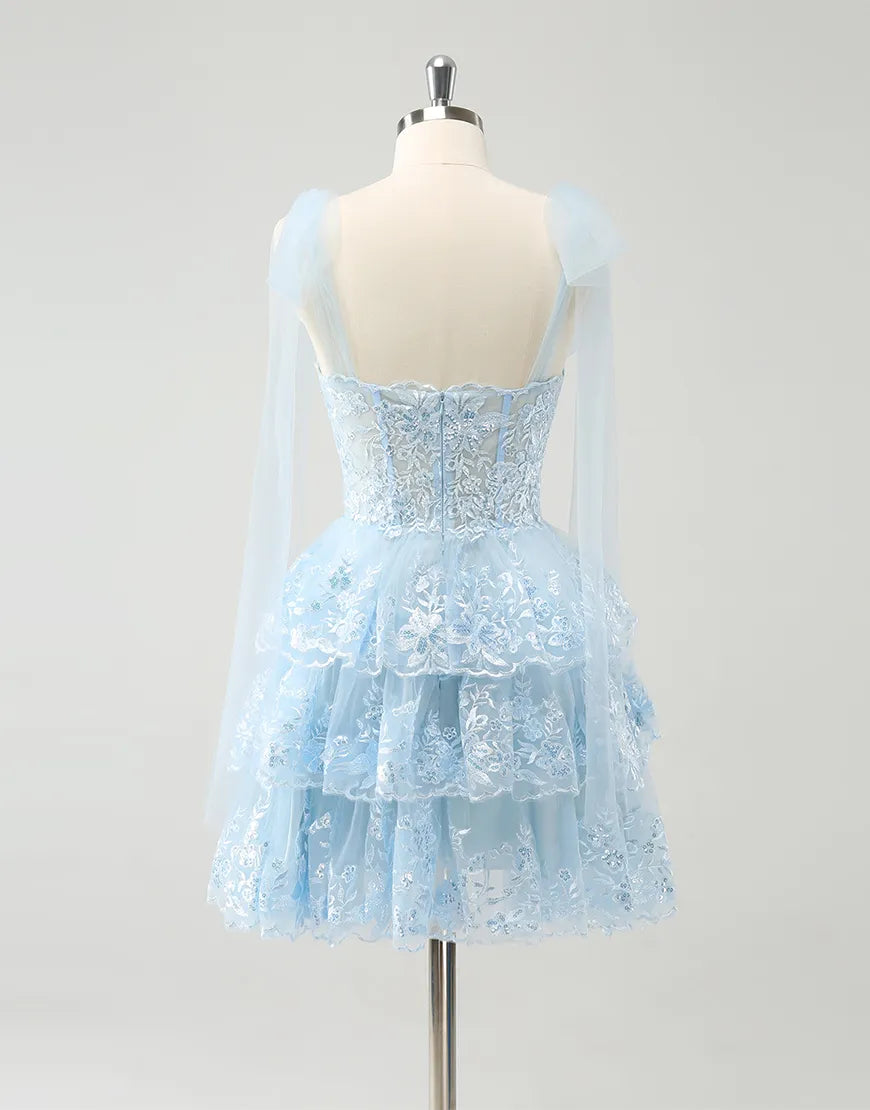 Back view of the A-line tiered tulle dress showing the flowing skirt.
