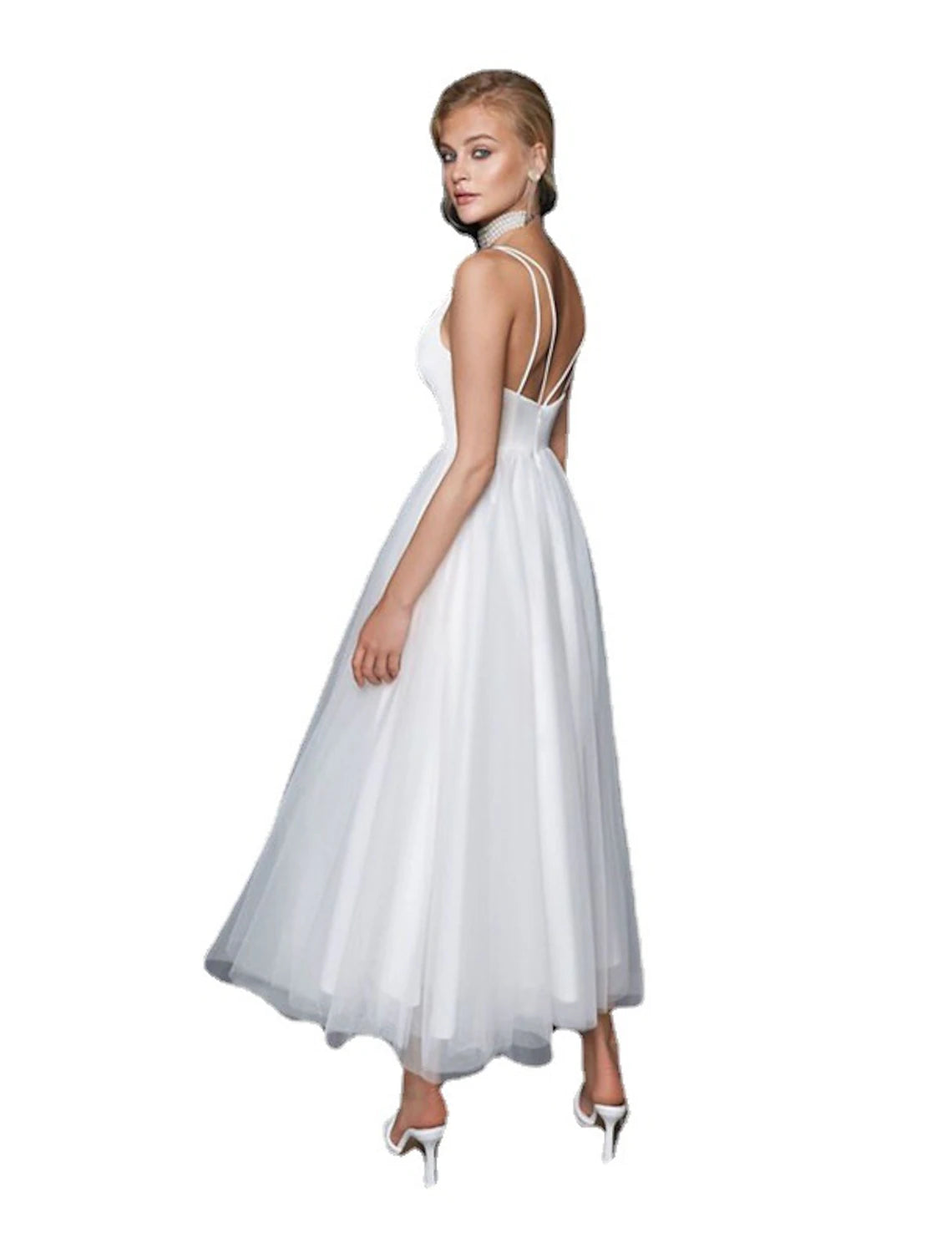 Side profile of elegant white reception dress.