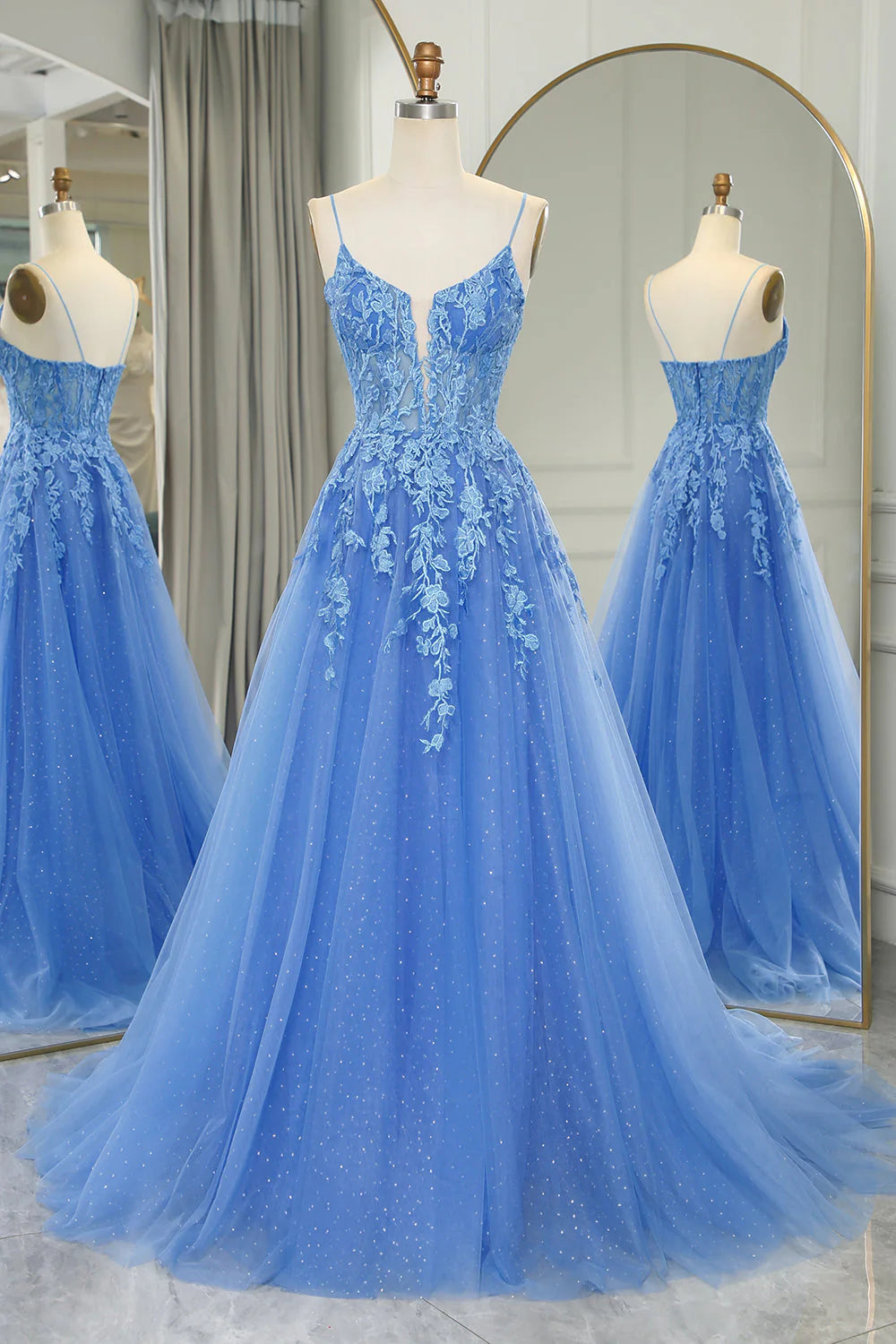 Elegant blue A-line tulle prom dress with appliques, front view.