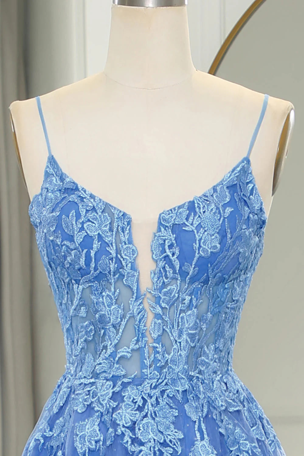 Back view of the blue A-line tulle prom dress, showcasing the flowing skirt.