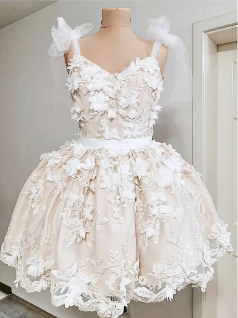 Short A-line V-neck dress with delicate tulle and floral appliques.