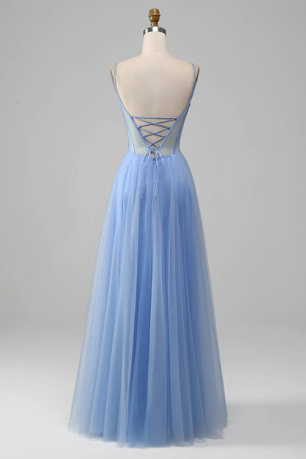 Blue A-line formal dress, showcasing the V-neckline and intricate appliques on tulle.