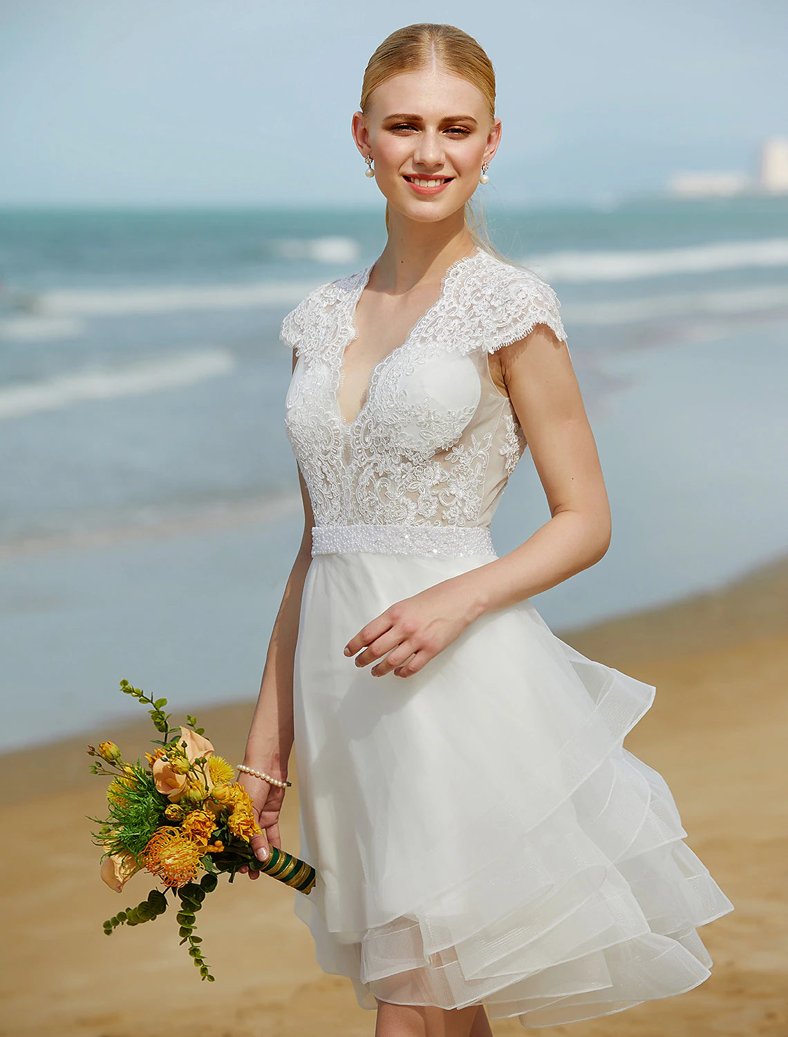 Back view of the sleeveless wedding dress with beading.