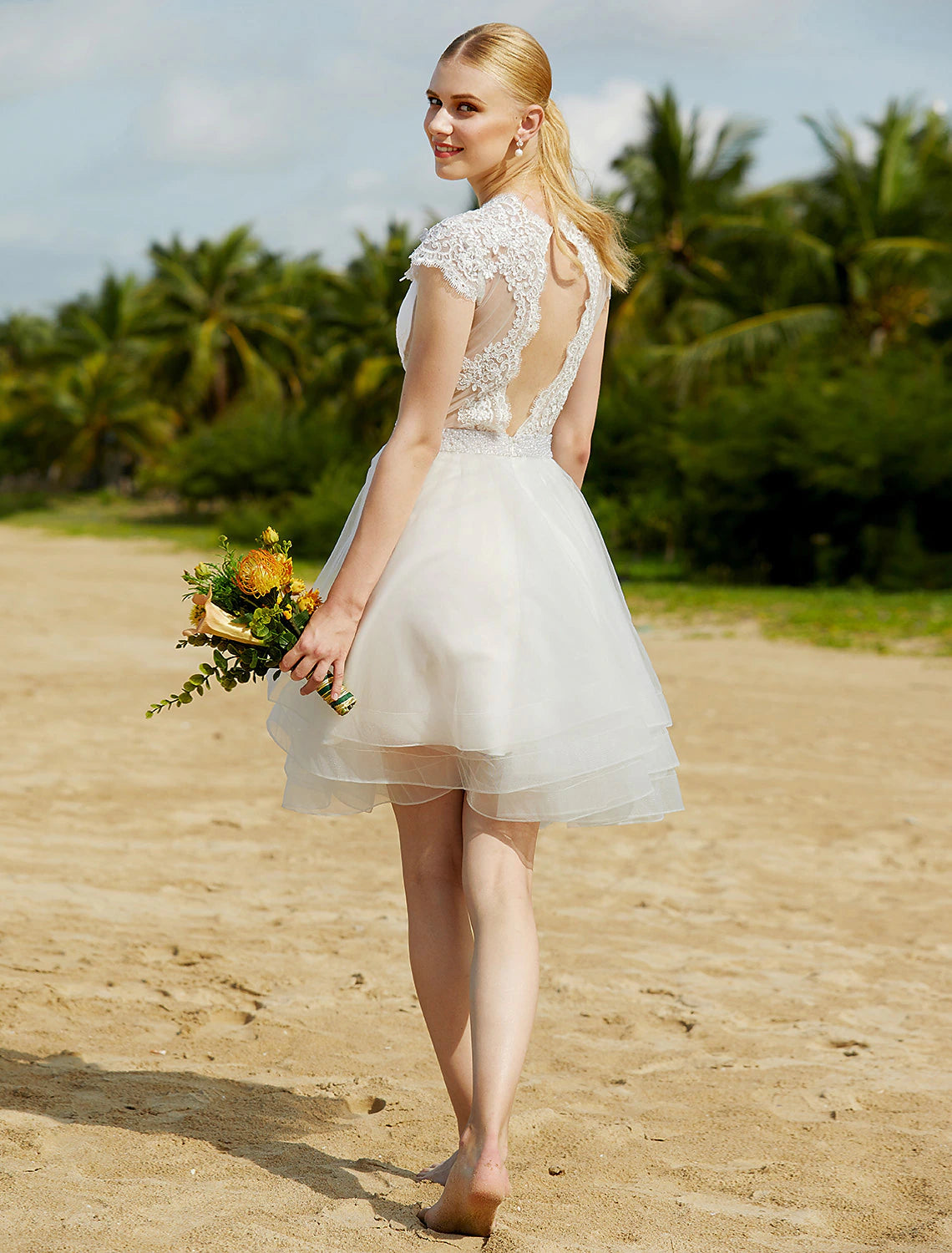 Full length shot of the V-Neck tulle wedding dress.