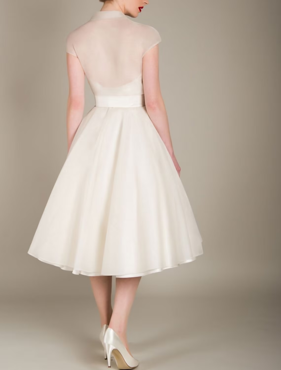 Back view of black A-line V-neck tulle graduation dress.