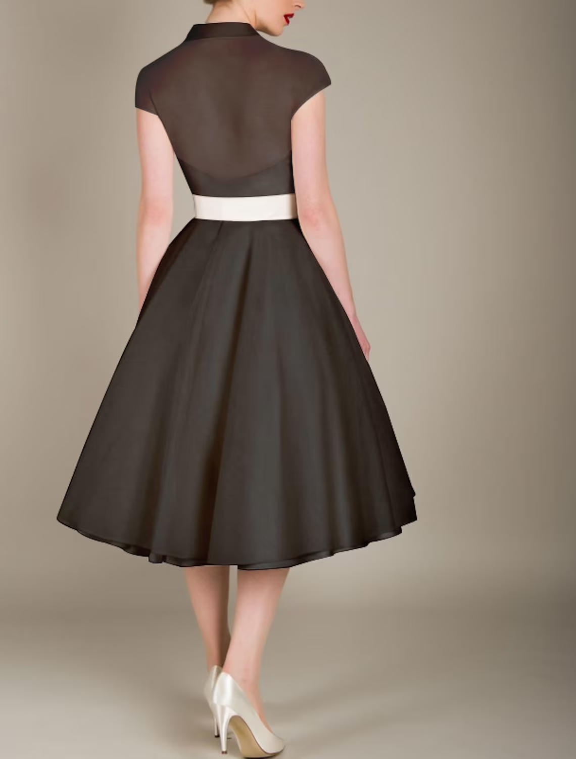 Close-up of black tulle fabric and V-neckline on dress.