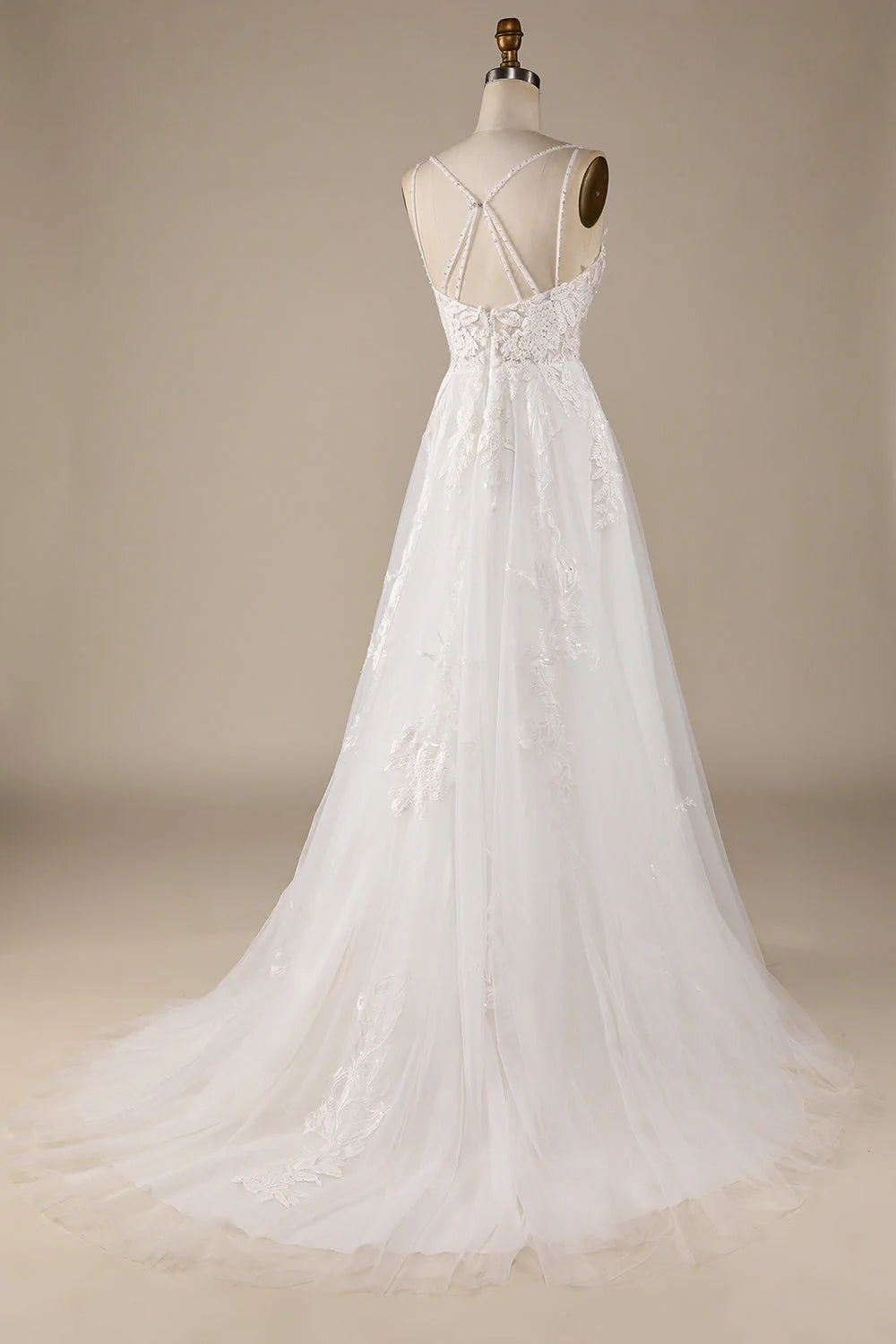 Side view of the ivory A-line tulle wedding dress, showcasing its flowing skirt.