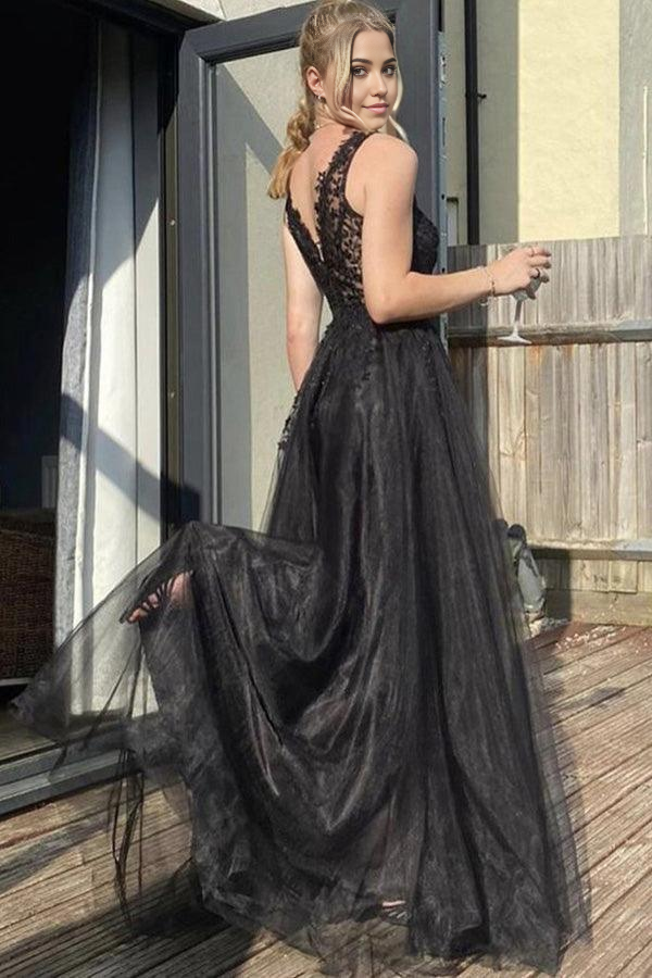 Full length view of a black formal A-line gown.