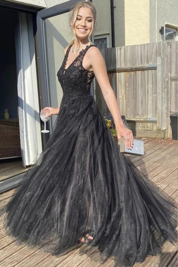 Close-up of the V-neckline and tulle fabric on the black dress.