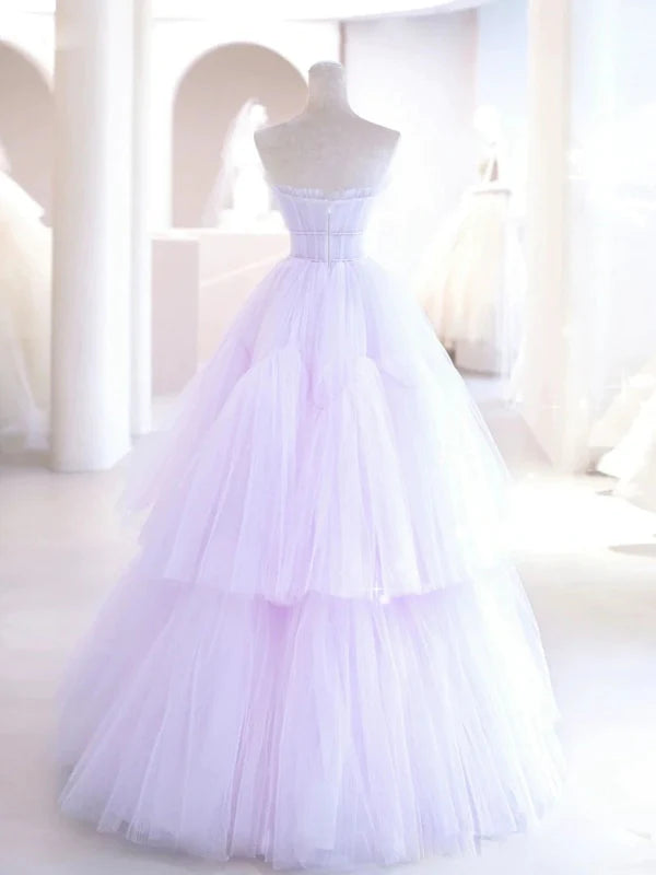 Back view of a flowing V-neck tulle prom gown.