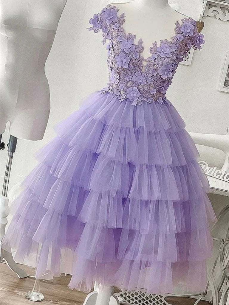 A-line short prom dress with V-neck, tulle, and lace appliques.