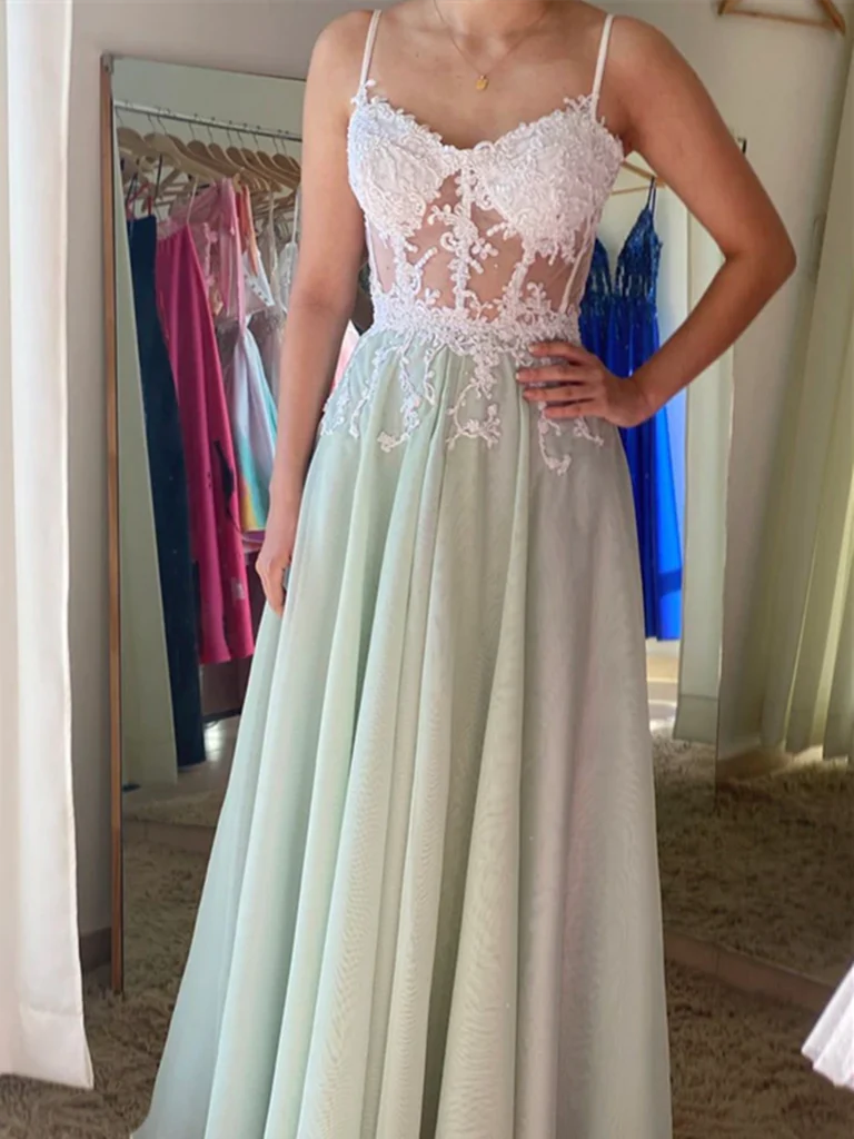 Model wearing an elegant A-line V-neck long prom dress with tulle and lace details.
