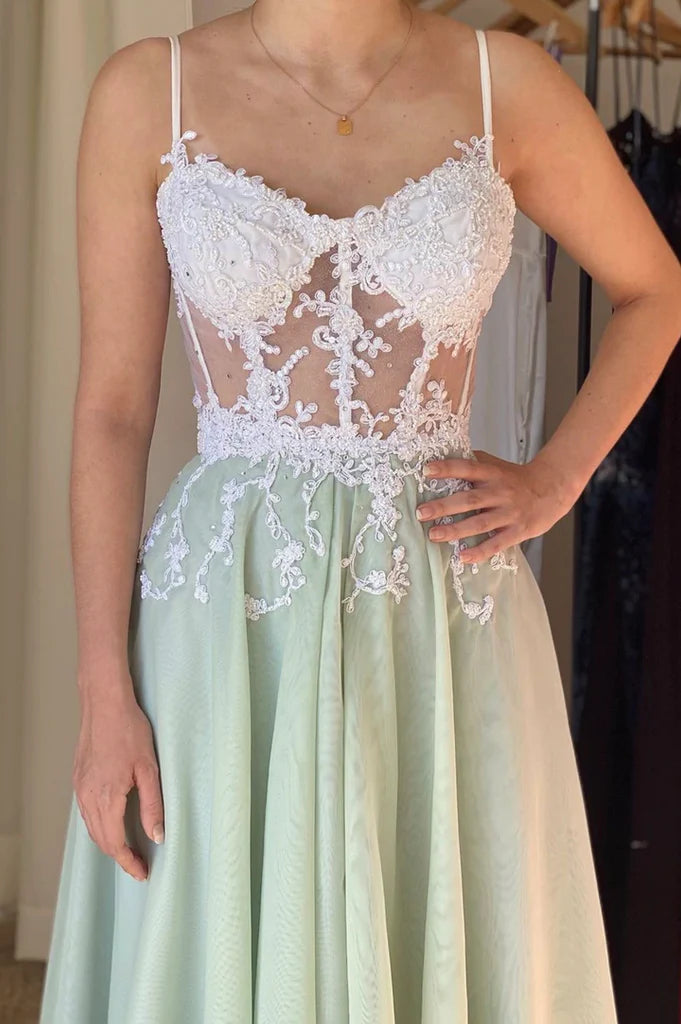 Close-up view of the intricate lace and flowing tulle on the A-line prom dress.