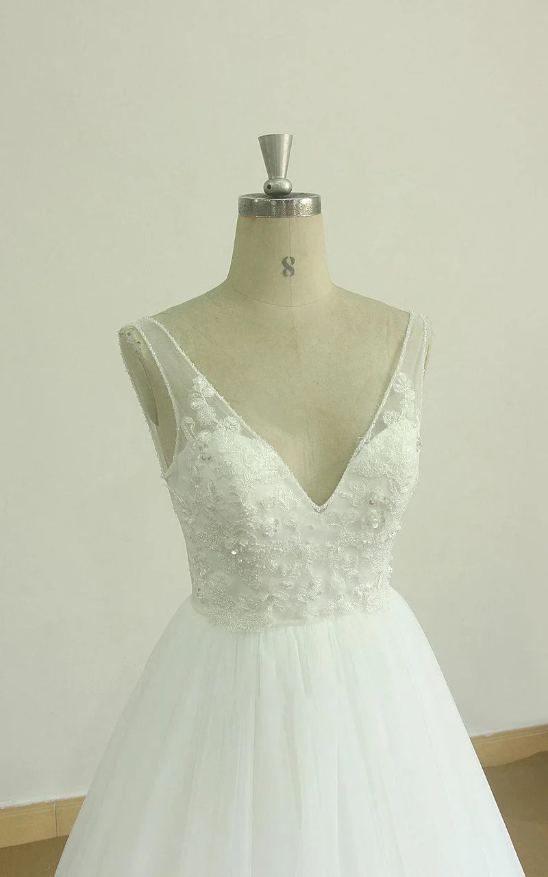 Back view of the A-Line wedding dress, highlighting the long train and delicate tulle.