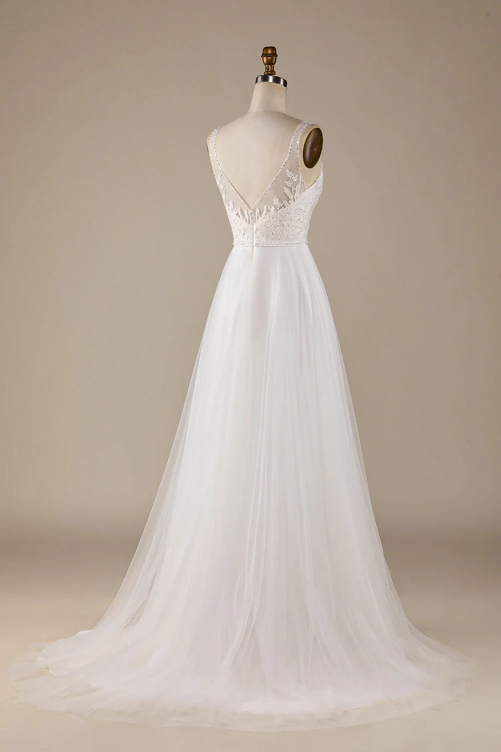 Back view of an ivory V-neck wedding dress, showcasing the sweep train and delicate lace.