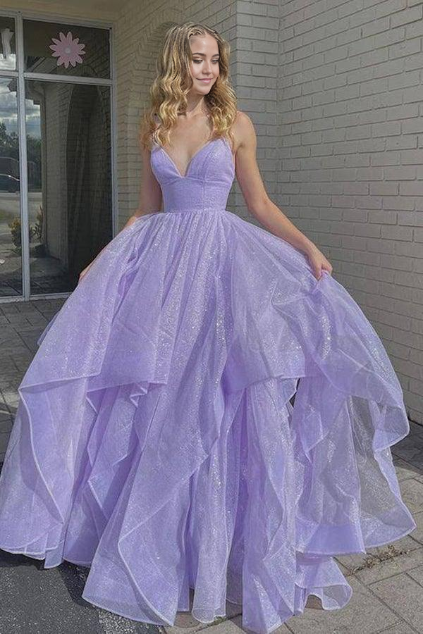 Model wearing a lilac A-line V-neck tulle long prom dress, front view.