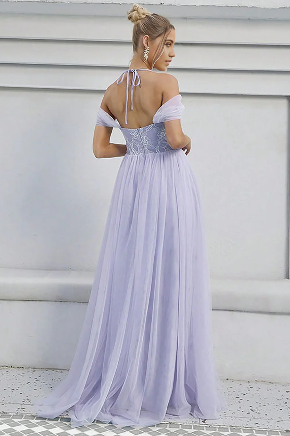 Side view of the flowing A-line tulle formal gown.