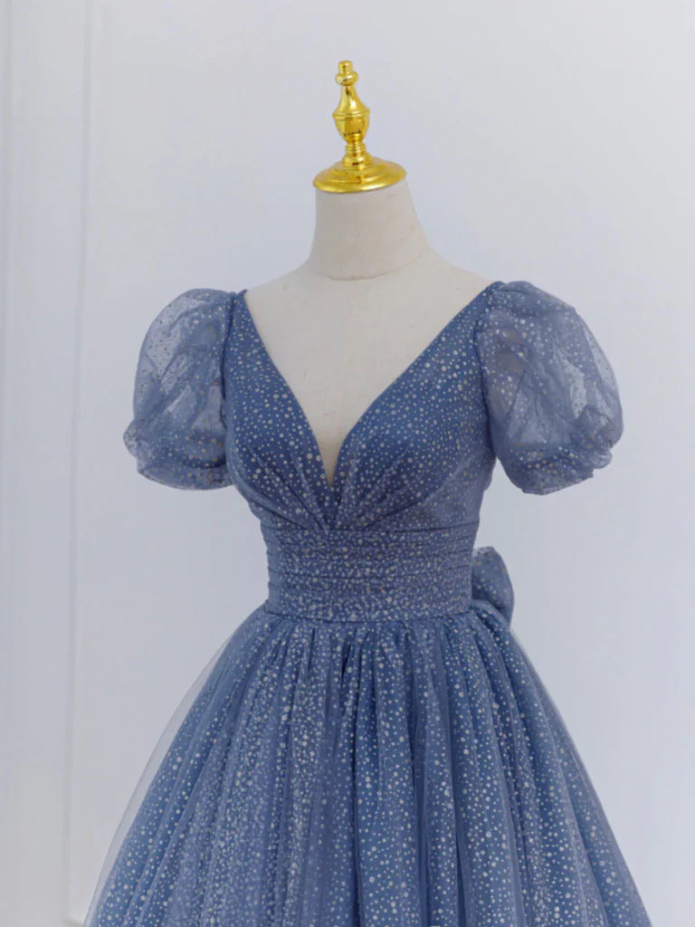 Close-up of the tulle fabric and V-neck detail on the prom dress.