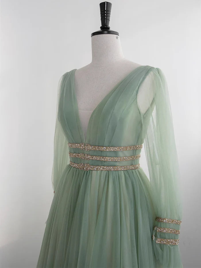 Side view of a mint green A-line V-neck tulle prom dress.