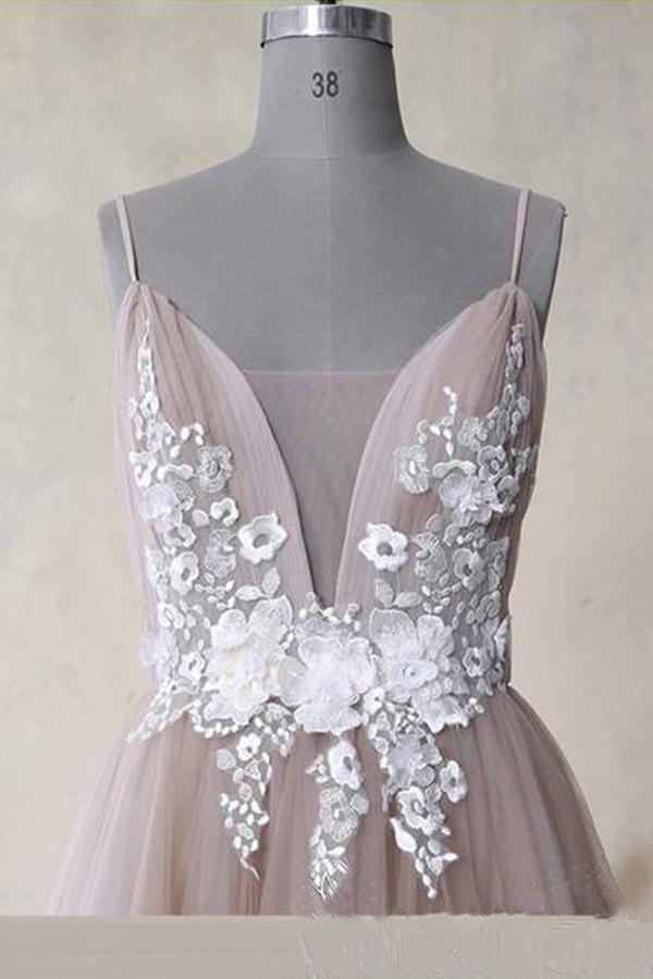 Back view of a long A-Line tulle prom dress with spaghetti straps.