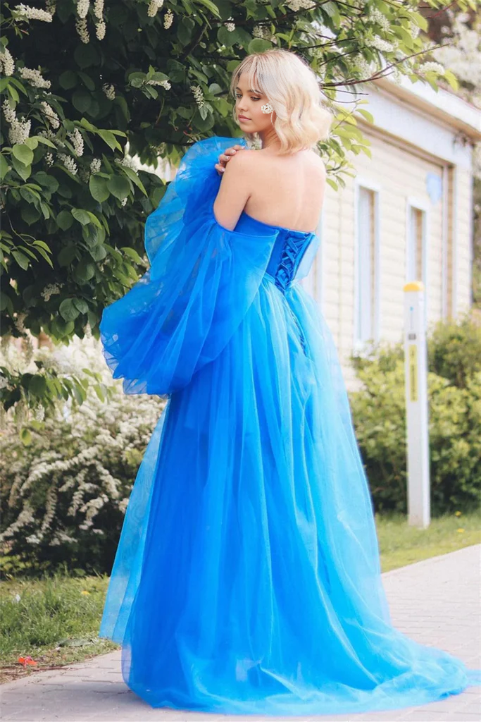 Side view of the long tulle prom dress showing the stylish leg slit.