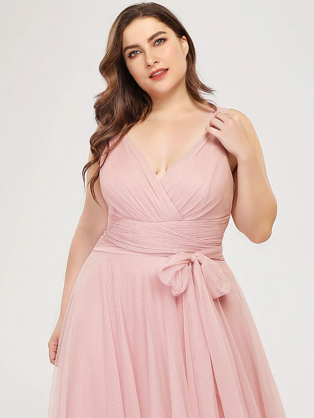 Close-up of the V-neckline and ruched bodice on the dress.