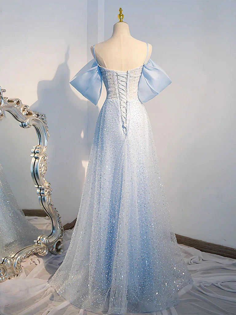 Side view of a woman wearing a long A-line sequin and tulle prom dress.