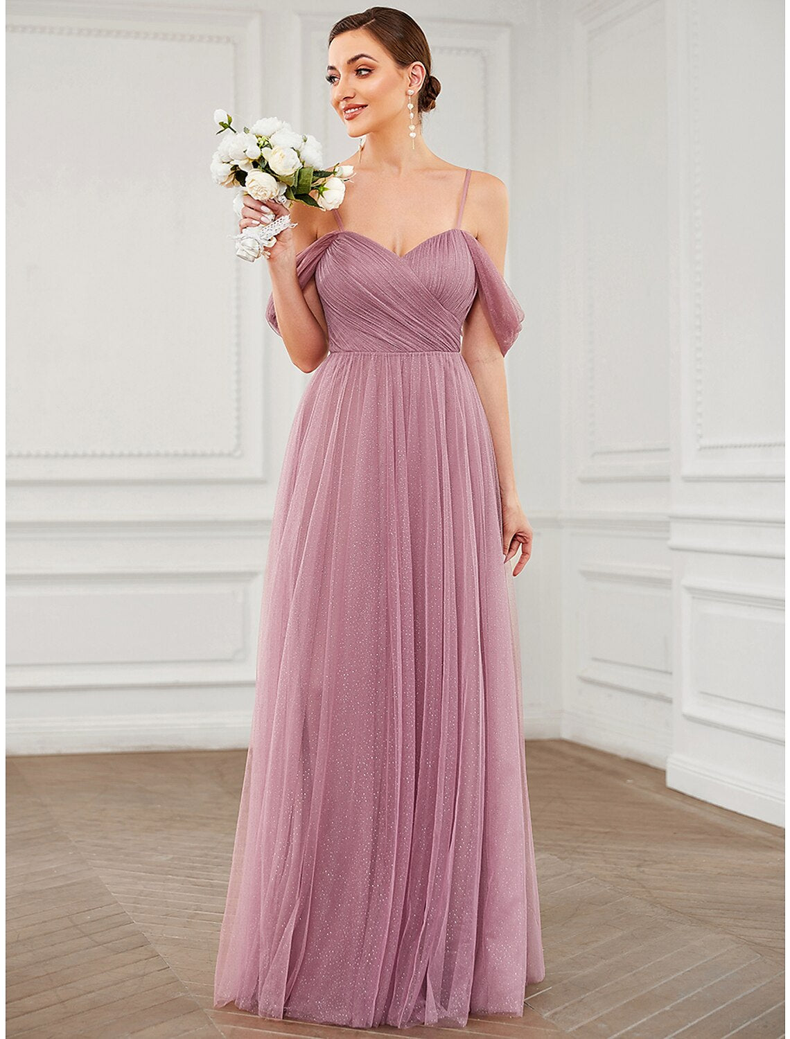Model wearing an elegant A-line V-neck tulle prom dress.