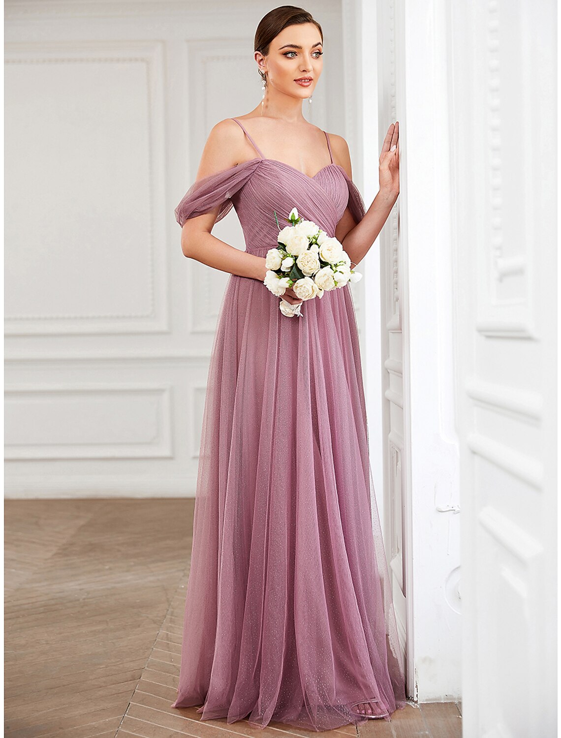 Close-up of the pleated tulle fabric on the A-line dress.