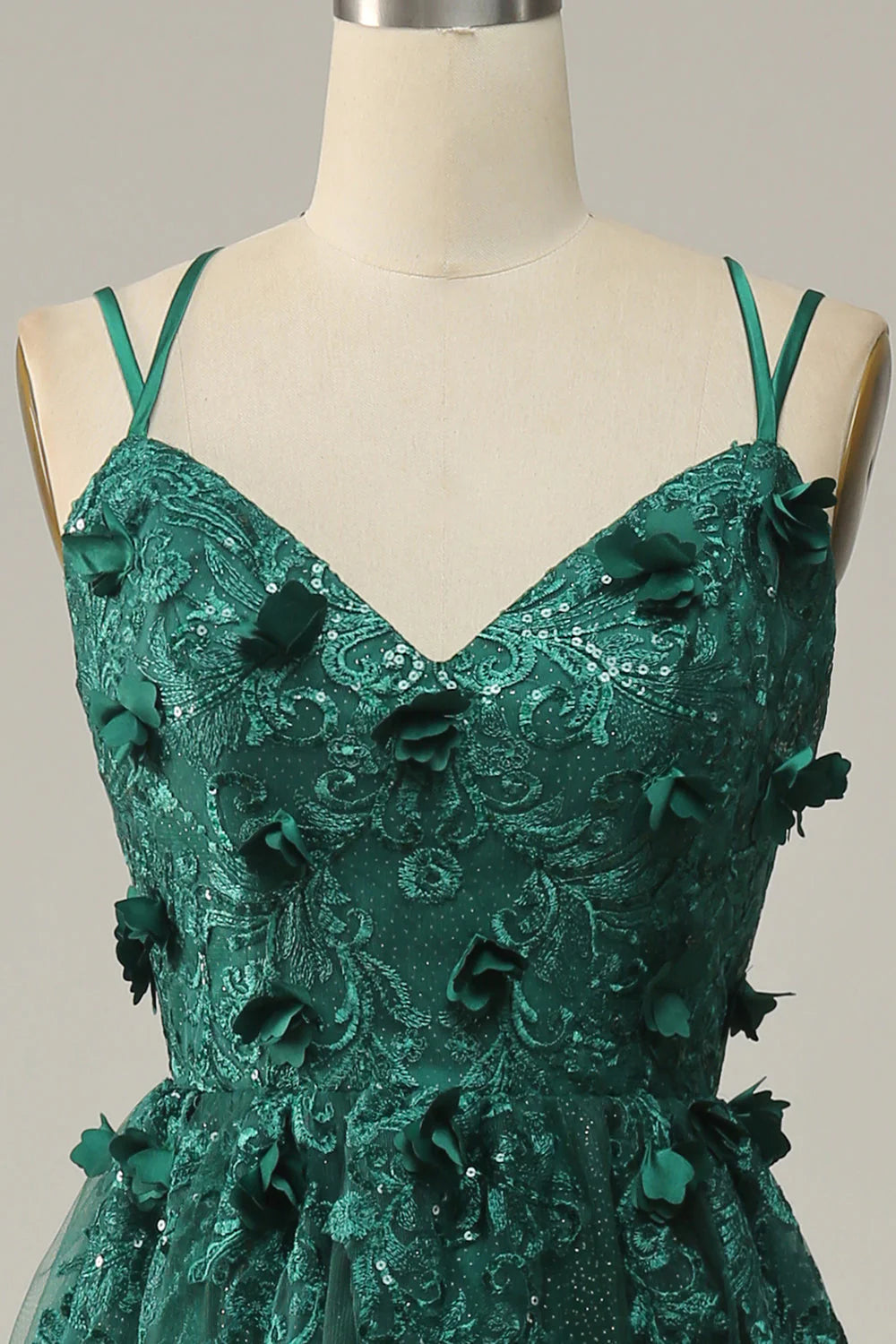 Back view of a dark green tulle prom dress, highlighting the elegant A-line silhouette.