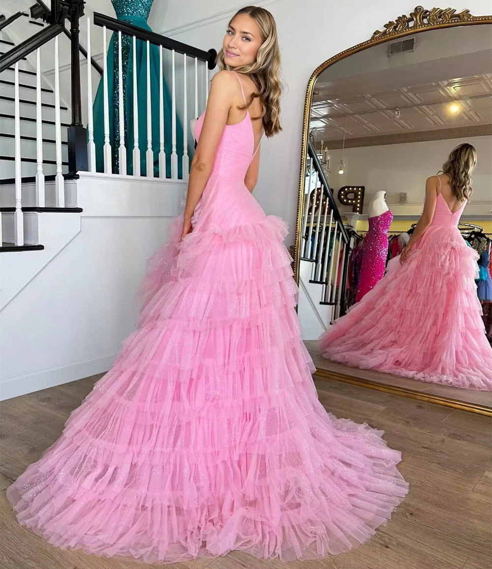 Back view of A-line tulle prom dress showing tiered skirt detail.