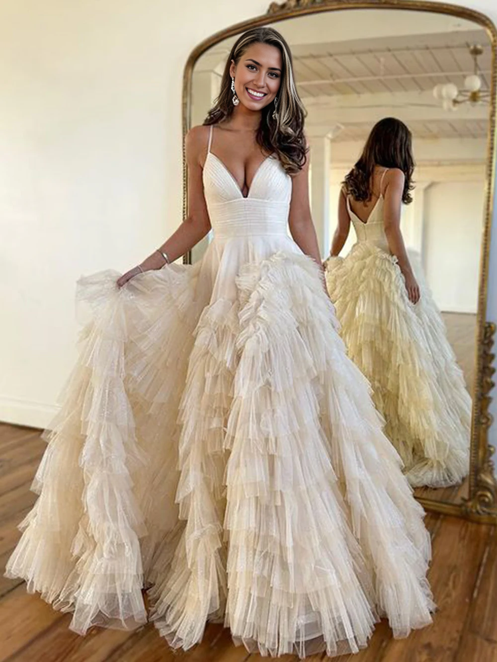 Full length view of the A-line tulle spaghetti strap prom dress.