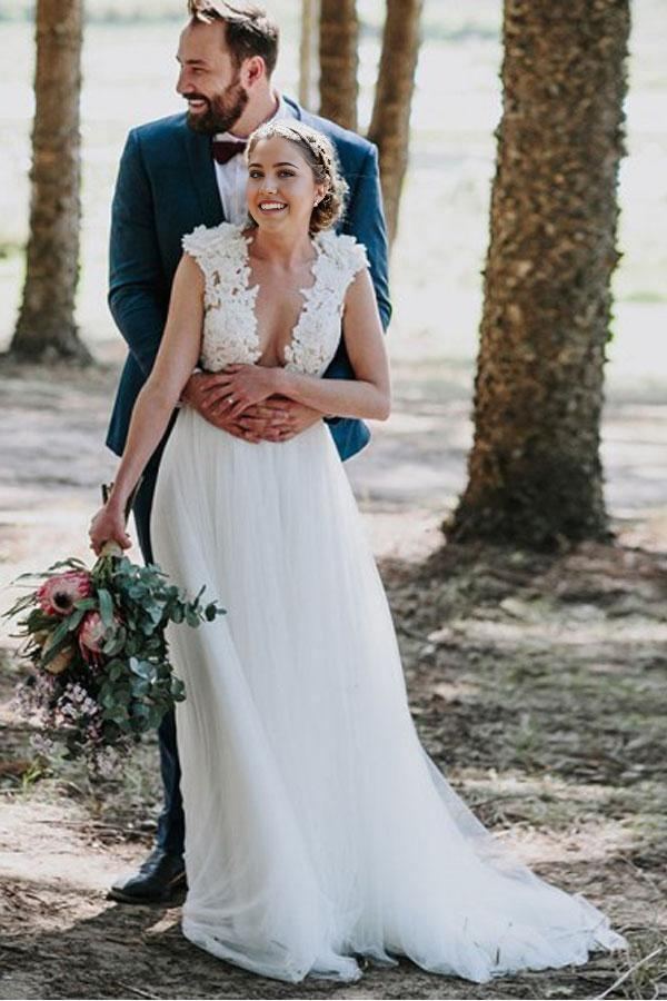 Elegant A-Line V-neck white tulle wedding dress with appliques and sweep train.