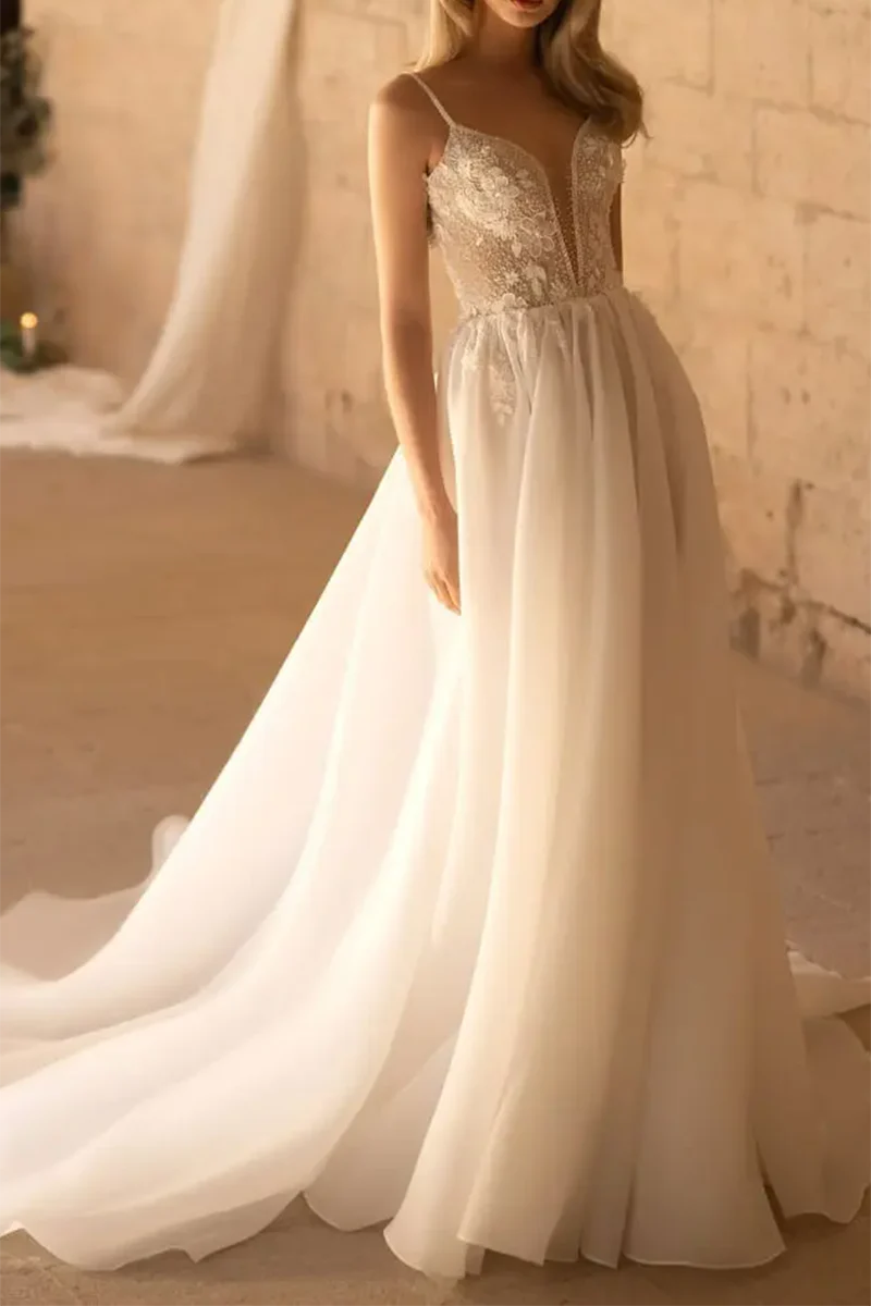 Model wearing an elegant A-line V-neck wedding dress with 3D appliques.