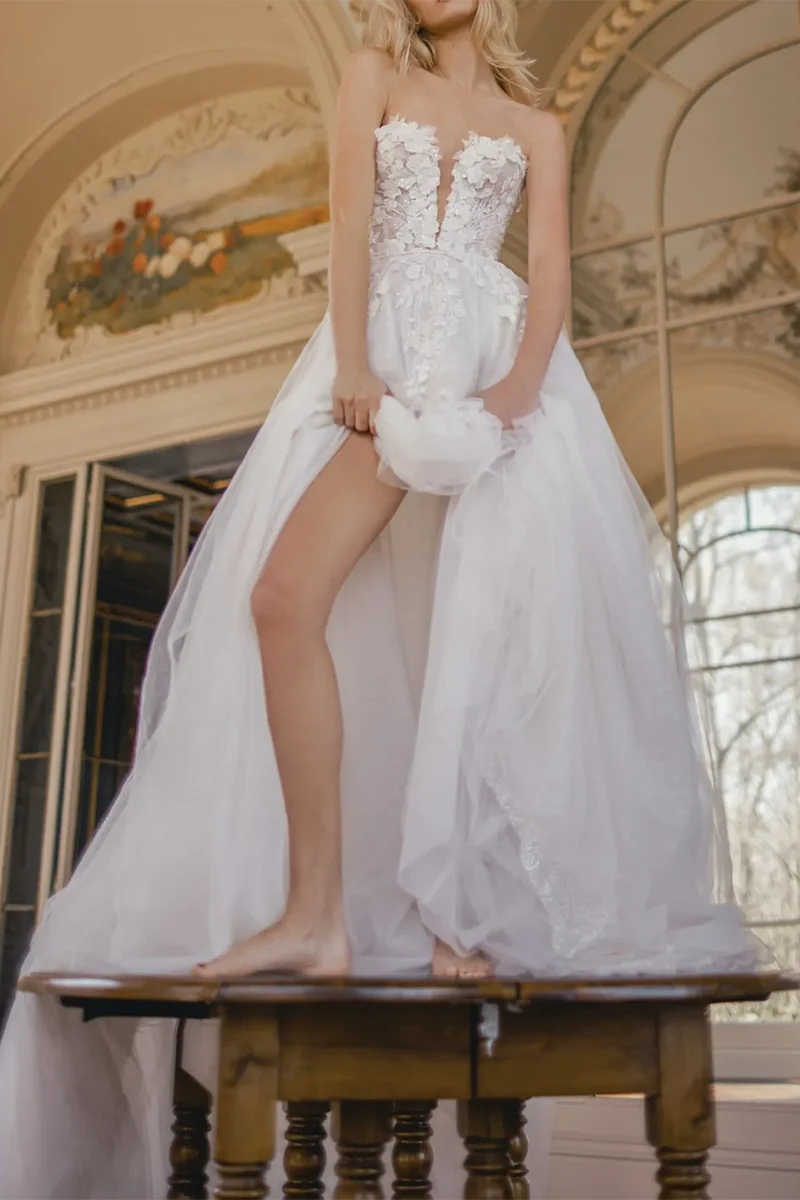 Side view of the A-line bridal gown with flowing court train.