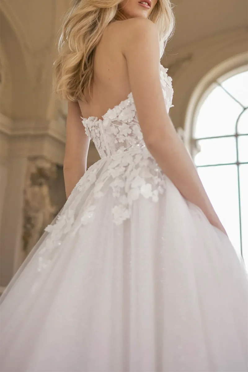 Full length view of the sleeveless A-line wedding dress.