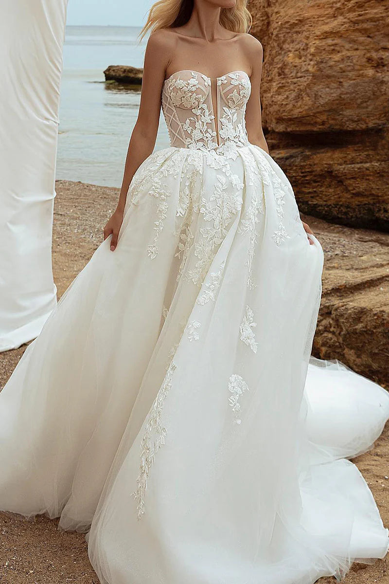 A-line V-neck wedding dress with long lace appliques sleeves, front view.