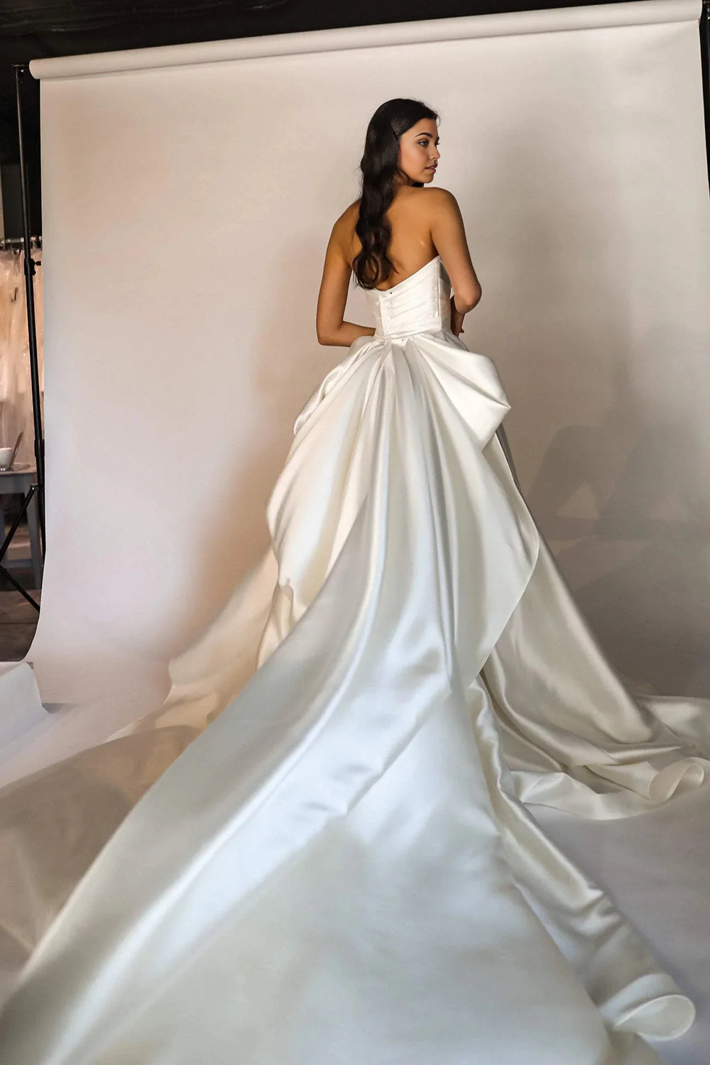 Back view of the A-line V-neck wedding dress, showcasing the sweep train.
