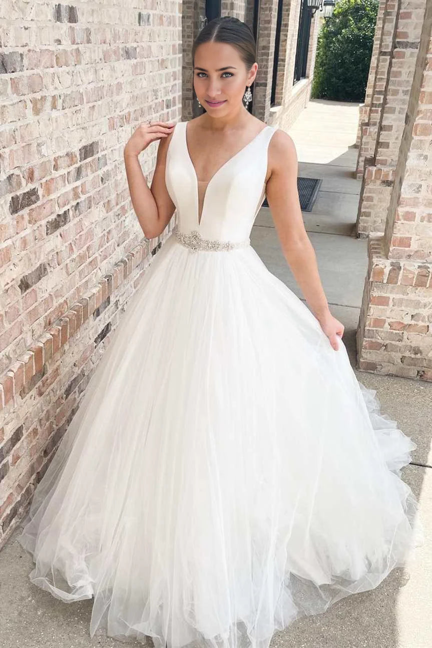 Elegant A-line V-neck long white wedding dress with sashes, front view.