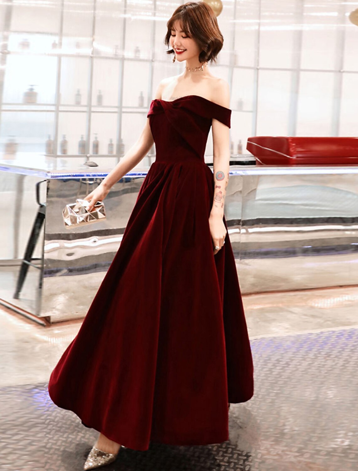 Elegant A-Line velvet off-shoulder evening gown.