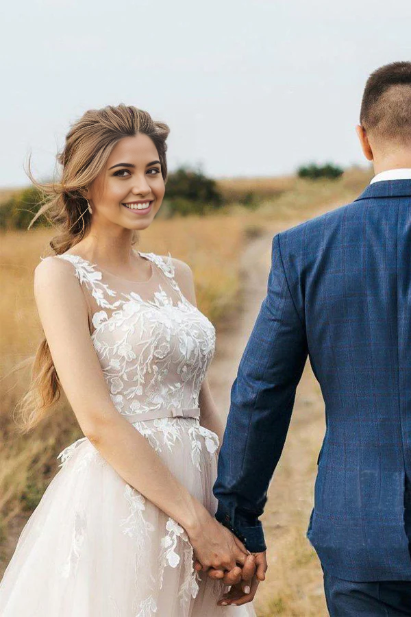 Side view of a bride wearing the elegant A-line vintage wedding gown.