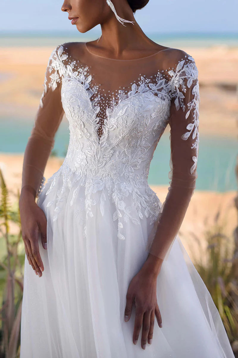 Detail of the lace appliques on the wedding dress bodice.