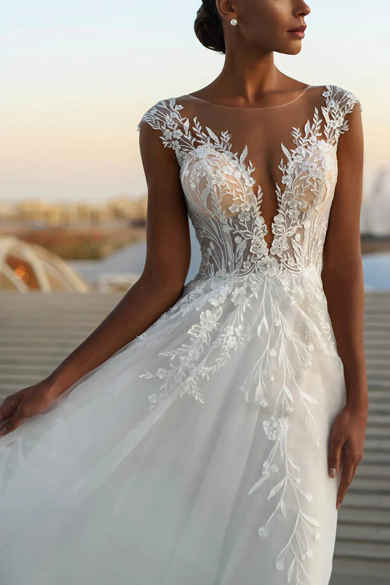 Side view of the A-line wedding dress, showcasing its flowing silhouette and lace details.