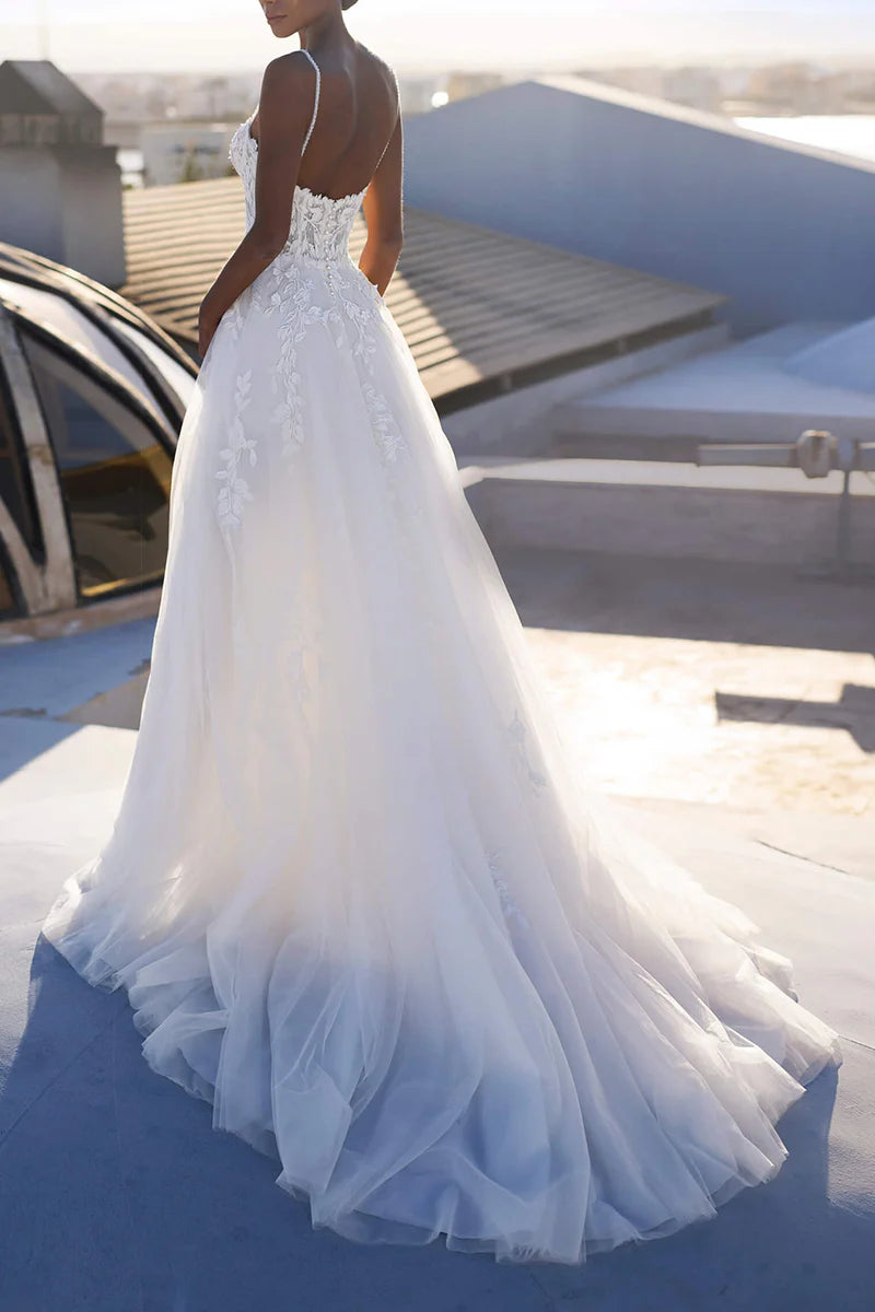 Side view of an A-line bridal gown featuring delicate lace details.
