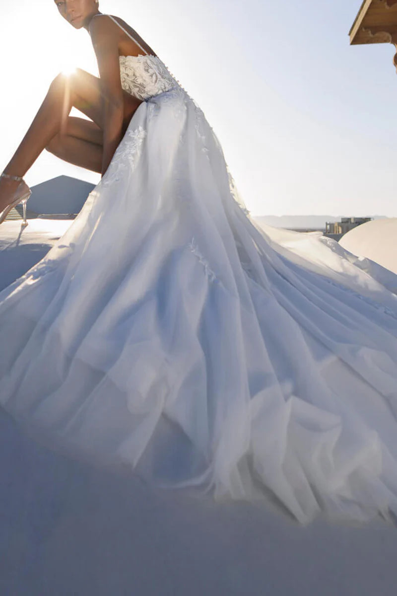 Close-up of lace appliques on the bodice of the wedding dress.