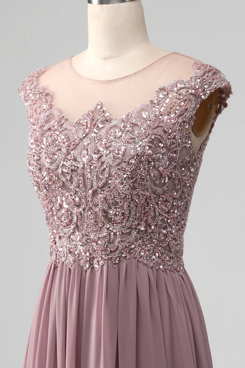 Side view of the woman in the A-line beaded mother of the bride dress.