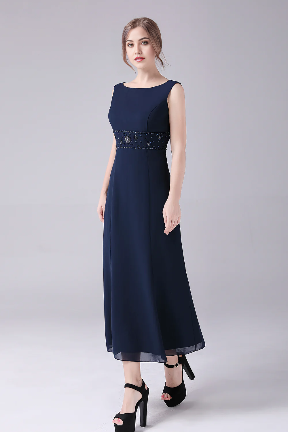 Side profile of woman wearing the boat neck long sleeve dress.